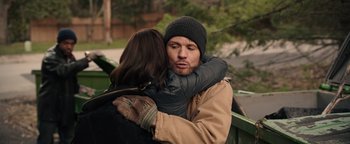 Movie still from “Wish Upon” (2017), directed by John R. Leonetti – A man and a woman hugging each other outside; Close Up shot, Over the shoulder angle