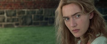 Movie still from “Little Children” (2006), directed by Todd Field – A person with long hair; Close Up shot, Over the shoulder angle