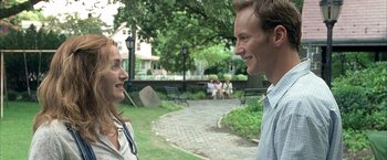 Movie still from “Little Children” (2006), directed by Todd Field – A man and a woman talking in a park; Close Up shot, Over the shoulder angle