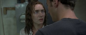 Movie still from “Little Children” (2006), directed by Todd Field – A man and a woman looking at one another; Close Up shot, Over the shoulder angle