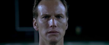 Movie still from “Little Children” (2006), directed by Todd Field – A man's face in a dark room; Close Up shot, Low angle