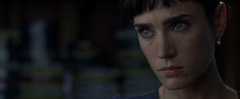 Movie still from “Little Children” (2006), directed by Todd Field – A person's face in a dark room; Close Up shot, Over the shoulder angle