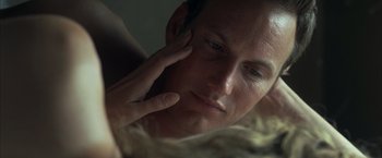Movie still from “Little Children” (2006), directed by Todd Field – A man's face while looking at the camera; Close Up shot, Over the shoulder angle