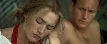 Movie still from “Little Children” (2006), directed by Todd Field – A person laying on a bed; Close Up shot, High angle