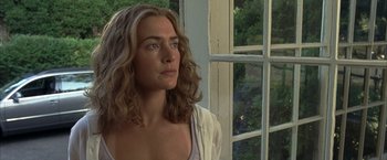 Movie still from “Little Children” (2006), directed by Todd Field – A woman standing in front of an open window; Close Up shot, Low angle