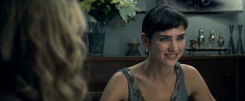 Movie still from “Little Children” (2006), directed by Todd Field – A woman sitting in front of another woman in front of a table; Close Up shot, Over the shoulder angle