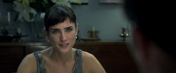 Movie still from “Little Children” (2006), directed by Todd Field – A person sitting in front of a window; Close Up shot, Over the shoulder angle