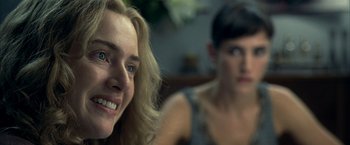 Movie still from “Little Children” (2006), directed by Todd Field – Two women sitting in front of each other; Close Up shot, Over the shoulder angle