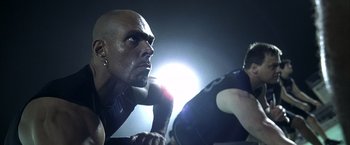 Movie still from “Little Children” (2006), directed by Todd Field – A bald man is looking at a woman in the dark; Close Up shot, Low angle