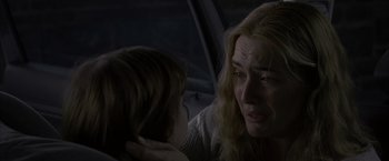 Movie still from “Little Children” (2006), directed by Todd Field – An older woman and a young boy in a car; Close Up shot, Over the shoulder angle