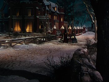 Movie still from “Little Women” (1949), directed by Mervyn LeRoy – A group of people standing next to each other on snow; Extreme Wide shot, High angle