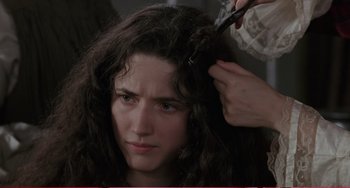 Movie still from “Little Women” (1994), directed by Gillian Armstrong – A woman getting her hair cut by a stylist; Close Up shot, Over the shoulder angle