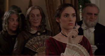 Movie still from “Little Women” (1994), directed by Gillian Armstrong – A woman holding a fan in front of another woman; Close Up shot, Over the shoulder angle