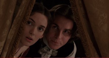 Movie still from “Little Women” (1994), directed by Gillian Armstrong – A man and a woman are looking at the camera; Close Up shot, Low angle