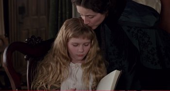 Movie still from “Little Women” (1994), directed by Gillian Armstrong – A woman and a child reading a book; Close Up shot, High angle