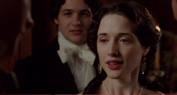 Movie still from “Little Women” (1994), directed by Gillian Armstrong – A man and a woman standing next to each other; Close Up shot, Over the shoulder angle