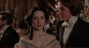 Movie still from “Little Women” (1994), directed by Gillian Armstrong – A man and a woman standing next to each other; Close Up shot, Over the shoulder angle