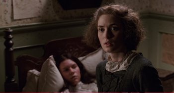 Movie still from “Little Women” (1994), directed by Gillian Armstrong – A young woman sitting in front of a young girl; Medium shot, Over the shoulder angle