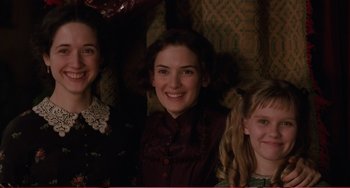 Movie still from “Little Women” (1994), directed by Gillian Armstrong – A group of young people posing for a picture; Close Up shot, High angle