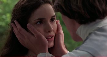 Movie still from “Little Women” (1994), directed by Gillian Armstrong – A man touching the face of a beautiful young woman; Close Up shot, Over the shoulder angle