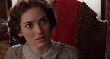 Movie still from “Little Women” (1994), directed by Gillian Armstrong – A person sitting on a chair; Close Up shot, Over the shoulder angle