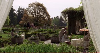 Movie still from “Little Women” (1994), directed by Gillian Armstrong – A man and a woman in the middle of a garden; Wide shot, High angle