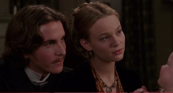 Movie still from “Little Women” (1994), directed by Gillian Armstrong – A man and a woman sitting next to each other; Close Up shot, Low angle