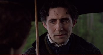 Movie still from “Little Women” (1994), directed by Gillian Armstrong – A person holding an umbrella; Close Up shot, Over the shoulder angle