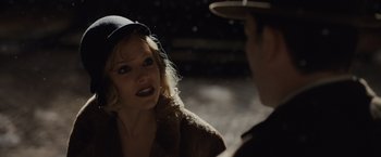 Movie still from “Live by Night” (2016), directed by Ben Affleck – A man and a woman talking to each other; Close Up shot, Over the shoulder angle