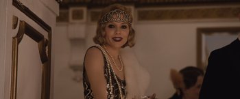 Movie still from “Live by Night” (2016), directed by Ben Affleck – A woman in a dress and a tiara; Close Up shot, Low angle