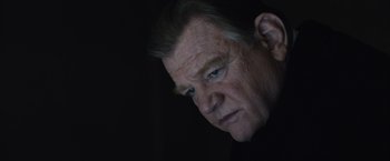 Movie still from “Live by Night” (2016), directed by Ben Affleck – An older man with blue eyes stares into the distance; Close Up shot, Low angle