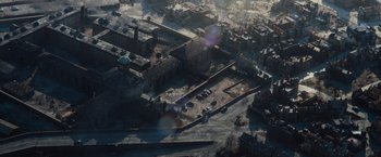 Movie still from “Live by Night” (2016), directed by Ben Affleck – An aerial view of an industrial area with buildings; Extreme Wide shot, High angle