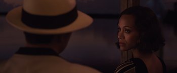 Movie still from “Live by Night” (2016), directed by Ben Affleck – A man and a woman are looking into a mirror; Close Up shot, Over the shoulder angle