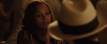 Movie still from “Live by Night” (2016), directed by Ben Affleck – A person sitting in front of a mirror; Close Up shot, Over the shoulder angle