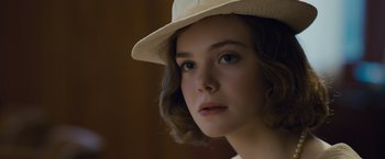 Movie still from “Live by Night” (2016), directed by Ben Affleck – A person wearing a hat; Close Up shot, Over the shoulder angle