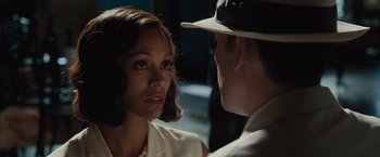 Movie still from “Live by Night” (2016), directed by Ben Affleck – A man and a woman talking to each other; Close Up shot, Over the shoulder angle