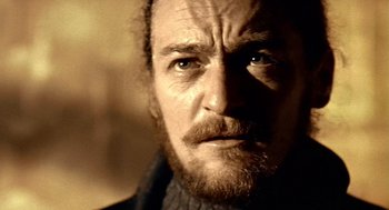 Movie still from “Lock, Stock and Two Smoking Barrels” (1998), directed by Guy Ritchie – A person with a beard; Close Up shot, Low angle