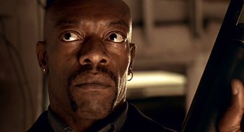 Movie still from “Lock, Stock and Two Smoking Barrels” (1998), directed by Guy Ritchie – A man's face looking upward; Close Up shot, Low angle