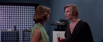 Movie still from “Logan's Run” (1976), directed by Michael Anderson – A man and a woman talking to each other; Medium shot, Over the shoulder angle