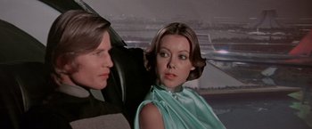 Movie still from “Logan's Run” (1976), directed by Michael Anderson – A man and a woman sitting in the back of a car; Close Up shot, Low angle