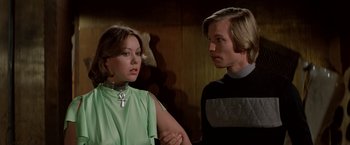 Movie still from “Logan's Run” (1976), directed by Michael Anderson – A man and a woman standing next to each other; Close Up shot, Over the shoulder angle