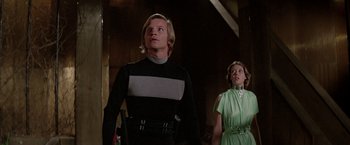 Movie still from “Logan's Run” (1976), directed by Michael Anderson – A man and a woman standing next to each other; Medium shot, Low angle