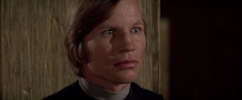 Movie still from “Logan's Run” (1976), directed by Michael Anderson – A person wearing a black shirt; Close Up shot, Low angle