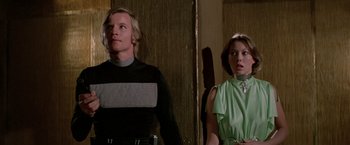 Movie still from “Logan's Run” (1976), directed by Michael Anderson – A man and a woman standing next to each other; Medium shot, Low angle