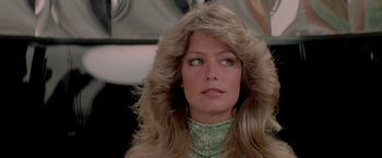 Movie still from “Logan's Run” (1976), directed by Michael Anderson – A person wearing a green dress; Close Up shot, Low angle