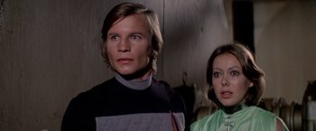 Movie still from “Logan's Run” (1976), directed by Michael Anderson – A man and a woman standing next to each other; Close Up shot, Low angle