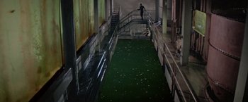 Movie still from “Logan's Run” (1976), directed by Michael Anderson – A man walking down the stairs of a building; Extreme Wide shot, High angle
