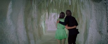 Movie still from “Logan's Run” (1976), directed by Michael Anderson – A man and a woman are walking through a cave; Wide shot, Low angle