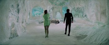 Movie still from “Logan's Run” (1976), directed by Michael Anderson – A man and a woman are standing in a cave; Wide shot, Low angle