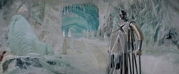 Movie still from “Logan's Run” (1976), directed by Michael Anderson – A group of people standing inside of an ice cave; Extreme Wide shot, High angle